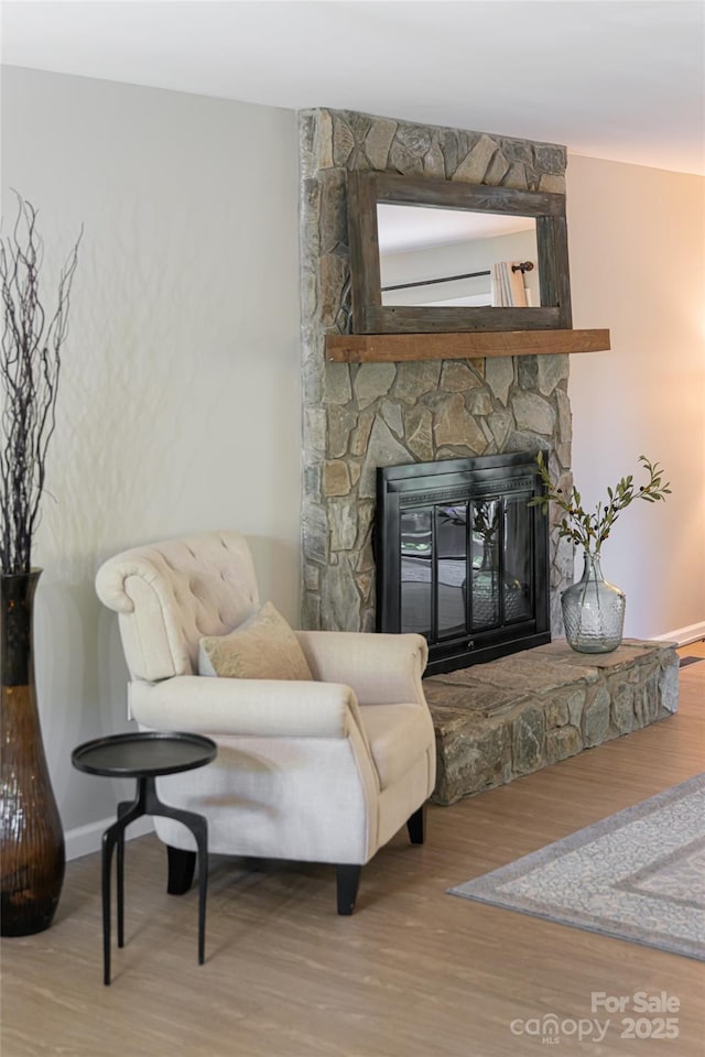 16 Royal Rdg, Clyde, NC 28721 - living area featuring wood finished floors, a fireplace, and baseboards