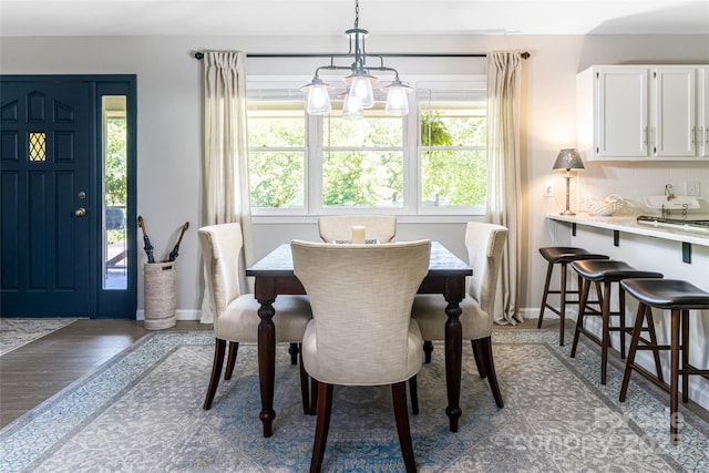 16 Royal Rdg, Clyde, NC 28721 - dining room with plenty of natural light, a chandelier, wood finished floors, and baseboards