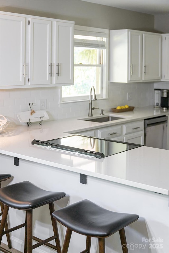 16 Royal Rdg, Clyde, NC 28721 - kitchen featuring a kitchen bar, a sink, and white cabinets