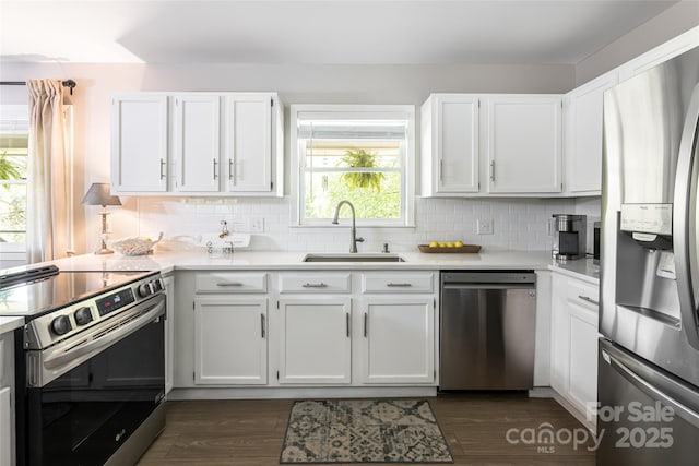 16 Royal Rdg, Clyde, NC 28721 - kitchen featuring appliances with stainless steel finishes, a sink, light countertops, and decorative backsplash