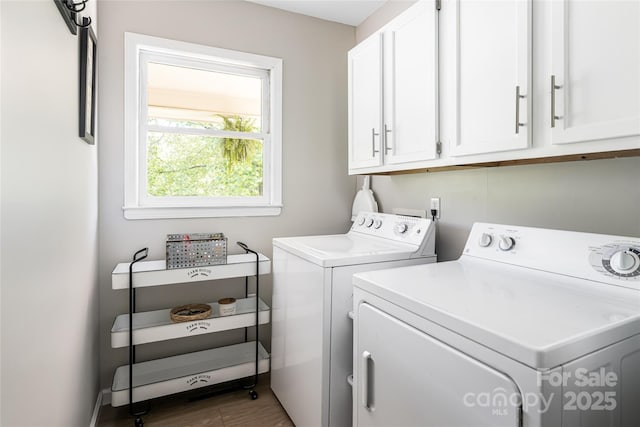 16 Royal Rdg, Clyde, NC 28721 - laundry area with cabinet space, separate washer and dryer, and wood finished floors
