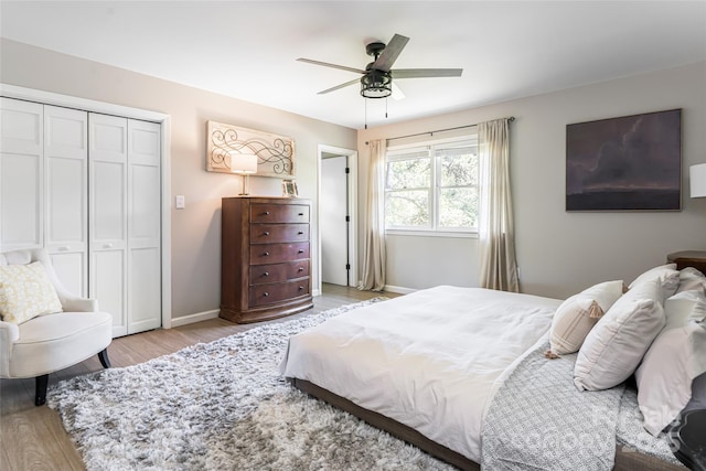 16 Royal Rdg, Clyde, NC 28721 - bedroom featuring light wood-style flooring, a closet, baseboards, and a ceiling fan