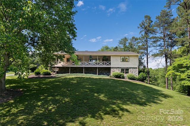 16 Royal Rdg, Clyde, NC 28721 - view of front facade featuring stone siding, a front yard, and a wooden deck