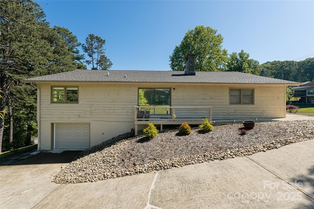 16 Royal Rdg, Clyde, NC 28721 - ranch-style home featuring concrete driveway, an attached garage, and roof with shingles