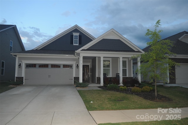 813 Latrobe Dr Unit 365, Iron Station, NC 28080 - craftsman-style house with a porch, concrete driveway, an attached garage, and a front yard