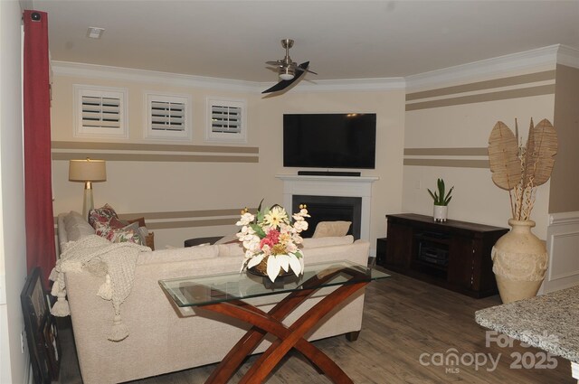 813 Latrobe Dr Unit 365, Iron Station, NC 28080 - living area with ceiling fan, crown molding, dark wood-style floors, and a fireplace