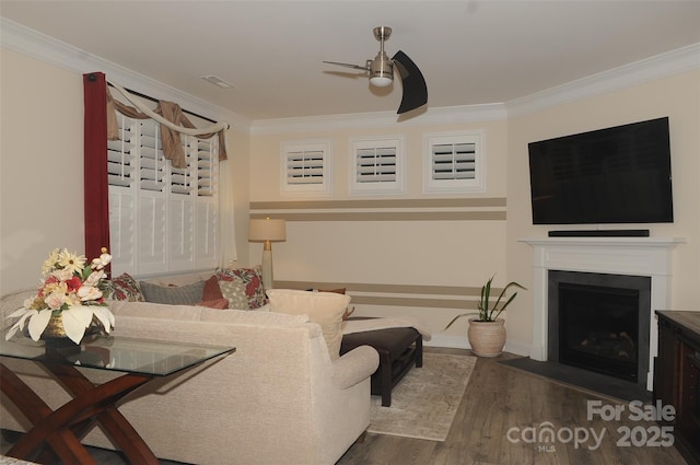 813 Latrobe Dr Unit 365, Iron Station, NC 28080 - living room featuring ceiling fan, ornamental molding, wood finished floors, a fireplace with flush hearth, and baseboards