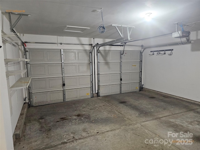 garage featuring a garage door opener