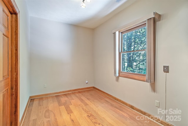 200 Maple Hill Dr, Flat Rock, NC 28731 - empty room with light wood finished floors and baseboards
