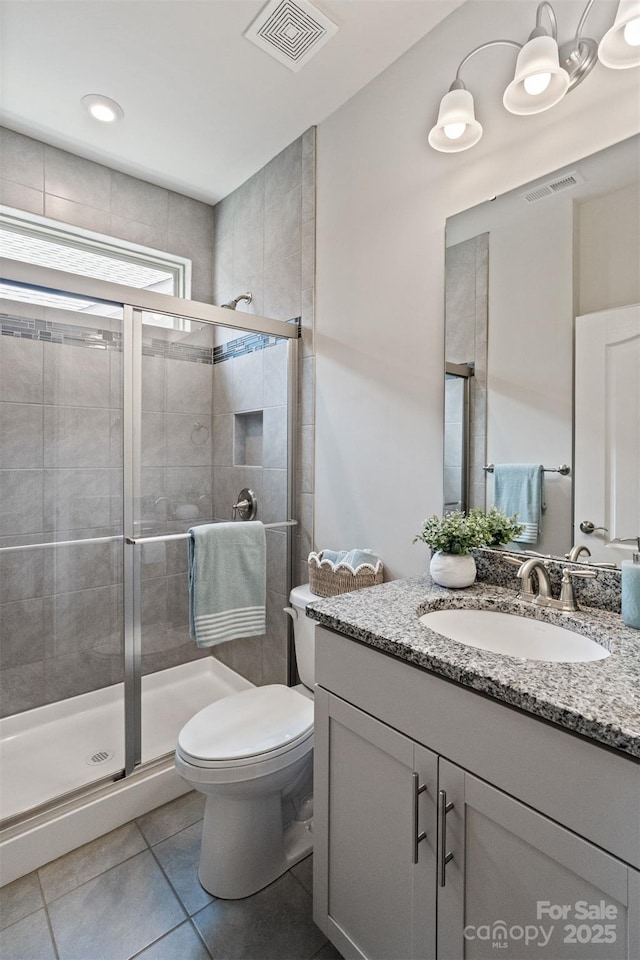 2329 Delaney Dr, Fort Mill, SC 29715 - full bath featuring vanity, a stall shower, toilet, and tile patterned floors