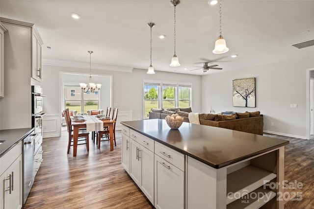 2329 Delaney Dr, Fort Mill, SC 29715 - kitchen with dark countertops, stainless steel appliances, recessed lighting, a chandelier, and ceiling fan