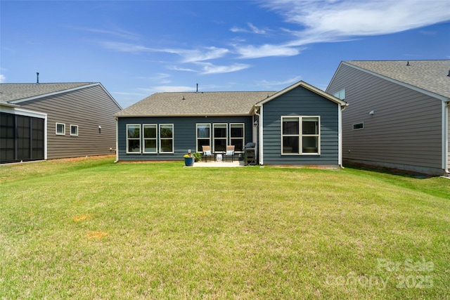 2329 Delaney Dr, Fort Mill, SC 29715 - back of house featuring a patio, a lawn, and a shingled roof