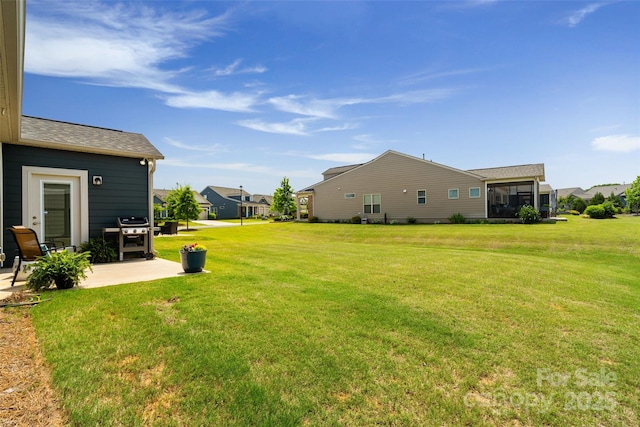 2329 Delaney Dr, Fort Mill, SC 29715 - view of grassy yard featuring a patio area and a residential view