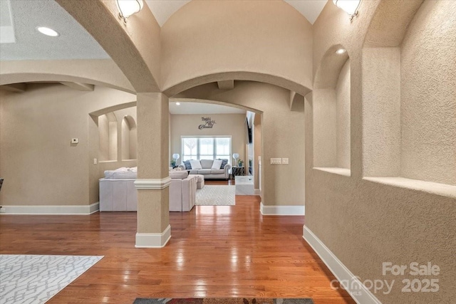 1974 Glen Manor Ct, Lincolnton, NC 28092 - hall with arched walkways, hardwood / wood-style floors, and baseboards