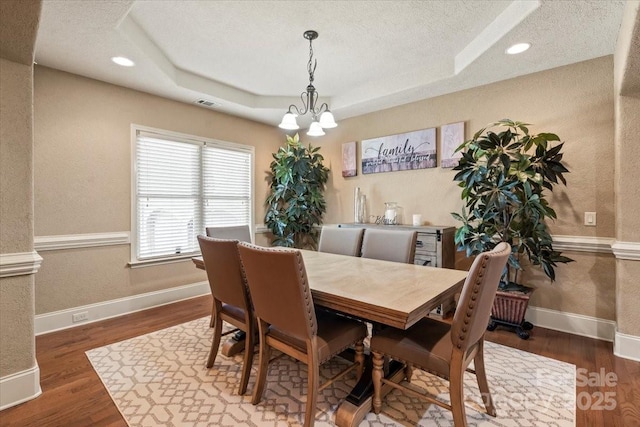 1974 Glen Manor Ct, Lincolnton, NC 28092 - dining room with a raised ceiling, wood finished floors, a textured ceiling, recessed lighting, and a textured wall
