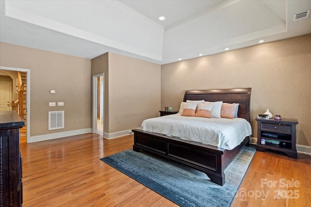 1974 Glen Manor Ct, Lincolnton, NC 28092 - bedroom with wood finished floors, a raised ceiling, and baseboards