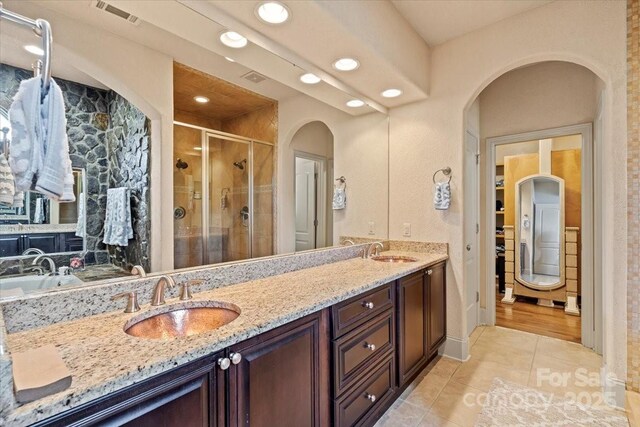 1974 Glen Manor Ct, Lincolnton, NC 28092 - bathroom with recessed lighting, tile patterned flooring, a shower stall, and double vanity