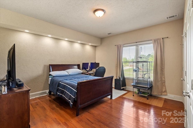 1974 Glen Manor Ct, Lincolnton, NC 28092 - bedroom featuring wood finished floors, baseboards, a desk, and a textured ceiling