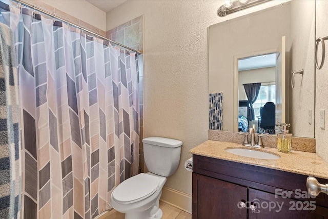 1974 Glen Manor Ct, Lincolnton, NC 28092 - ensuite bathroom featuring toilet, vanity, a shower with curtain, a textured wall, and baseboards