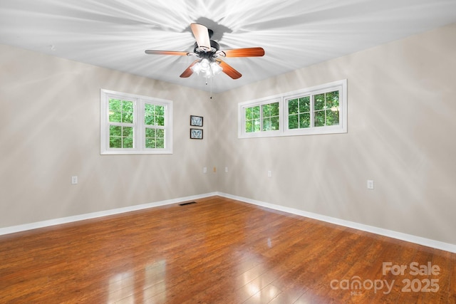 220 Pinehurst Ln, Newton, NC 28658 - spare room featuring hardwood / wood-style floors, ceiling fan, and baseboards