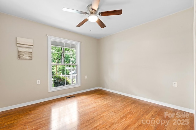 220 Pinehurst Ln, Newton, NC 28658 - unfurnished room with wood finished floors, baseboards, and a ceiling fan