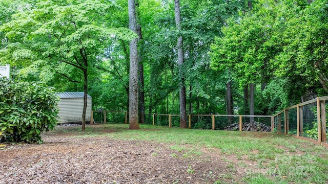 220 Pinehurst Ln, Newton, NC 28658 - fenced backyard with a shed and an outbuilding