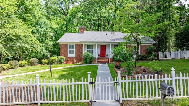 220 Pinehurst Ln, Newton, NC 28658 - view of front of home featuring a gate, brick siding, a chimney, and a shingled roof