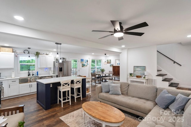 1135 Brook Path Trl, Denver, NC 28037 - living room with plenty of natural light, recessed lighting, dark wood-style flooring, a ceiling fan, and stairs