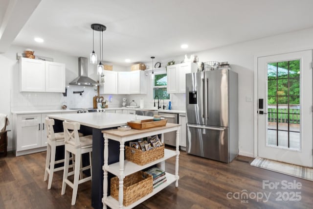 1135 Brook Path Trl, Denver, NC 28037 - kitchen featuring appliances with stainless steel finishes, wall chimney exhaust hood, light countertops, tasteful backsplash, and recessed lighting