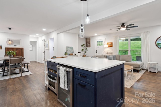 1135 Brook Path Trl, Denver, NC 28037 - kitchen featuring blue cabinetry, open floor plan, recessed lighting, dark wood-style flooring, and light countertops