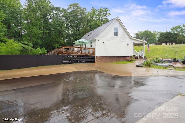 1135 Brook Path Trl, Denver, NC 28037 - view of property exterior with a wooden deck and fence
