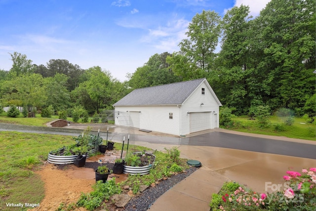 1135 Brook Path Trl, Denver, NC 28037 - view of property exterior with a garage, an outdoor structure, and a yard