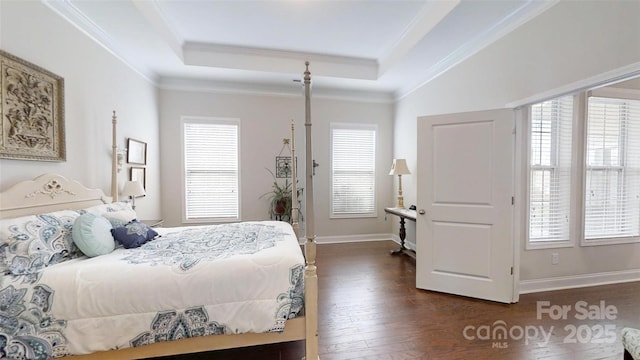 123 Hanks Bluff Dr, Mooresville, NC 28117 - bedroom featuring a tray ceiling, multiple windows, dark wood finished floors, ornamental molding, and baseboards