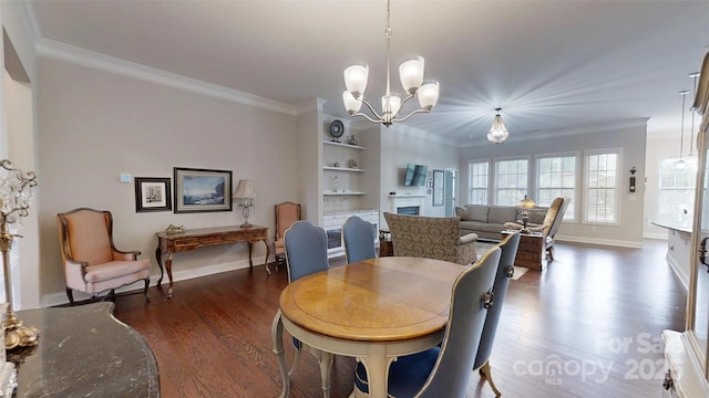 123 Hanks Bluff Dr, Mooresville, NC 28117 - dining area featuring ornamental molding, wood finished floors, a chandelier, baseboards, and built in features