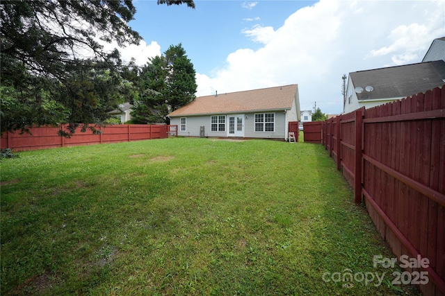 view of yard with french doors