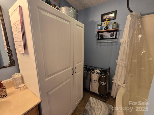 490 Deberry Rd, Mount Gilead, NC 27306 - full bath with a textured ceiling, vanity, and a shower with shower curtain