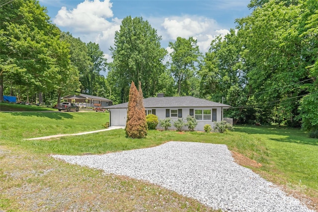518 Westside Cir, China Grove, NC 28023 - ranch-style house featuring gravel driveway, a front lawn, and a chimney