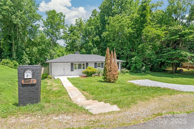 518 Westside Cir, China Grove, NC 28023 - view of front facade featuring a front lawn and a chimney