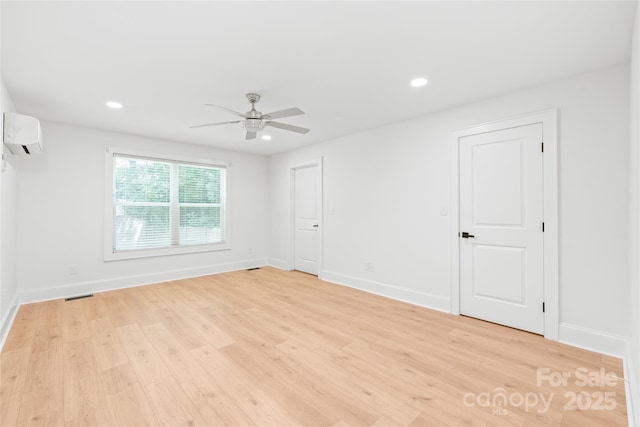 518 Westside Cir, China Grove, NC 28023 - empty room featuring a wall mounted air conditioner, a ceiling fan, light wood-style floors, baseboards, and recessed lighting