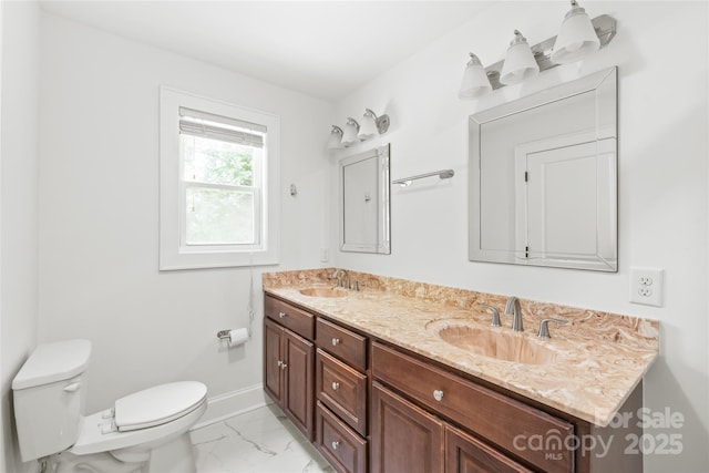 518 Westside Cir, China Grove, NC 28023 - bathroom with double vanity, toilet, marble look tile flooring, and baseboards