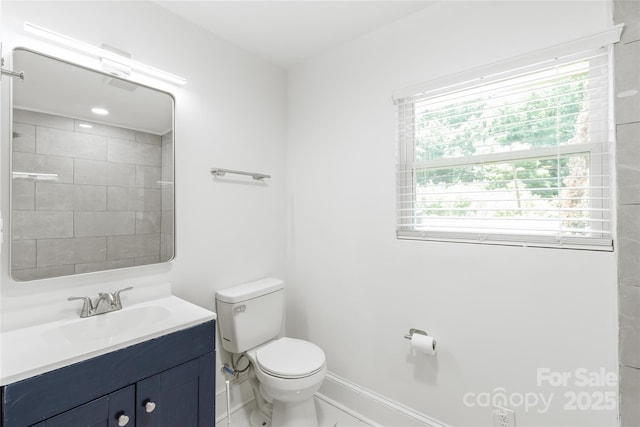 518 Westside Cir, China Grove, NC 28023 - bathroom with toilet, vanity, plenty of natural light, and baseboards