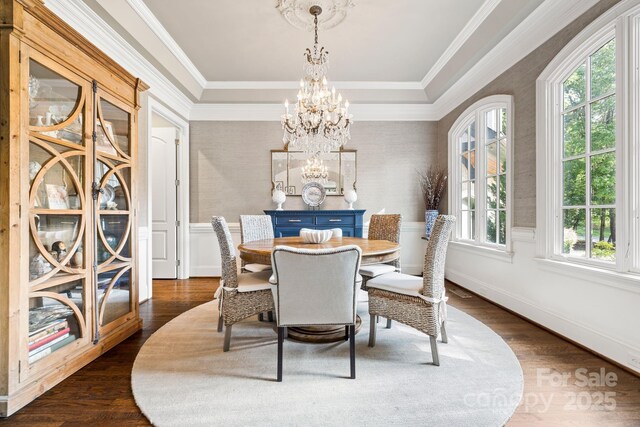 5523 Meadow Haven Ln, Charlotte, NC 28270 - dining space with a chandelier, dark wood-type flooring, ornamental molding, and a raised ceiling