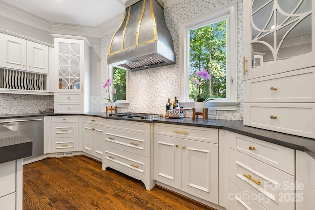 5523 Meadow Haven Ln, Charlotte, NC 28270 - kitchen with wall chimney exhaust hood, stainless steel appliances, decorative backsplash, dark countertops, and dark wood-style floors