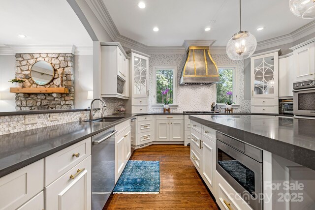 5523 Meadow Haven Ln, Charlotte, NC 28270 - kitchen featuring stainless steel appliances, ornamental molding, a sink, recessed lighting, and decorative backsplash
