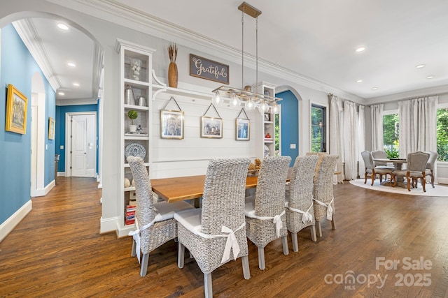 5523 Meadow Haven Ln, Charlotte, NC 28270 - dining space with arched walkways, crown molding, wood finished floors, recessed lighting, and baseboards