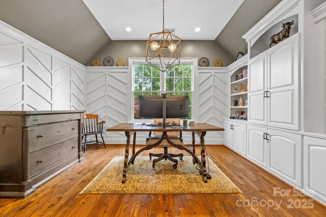 5523 Meadow Haven Ln, Charlotte, NC 28270 - office area with vaulted ceiling, a decorative wall, wood finished floors, a chandelier, and recessed lighting