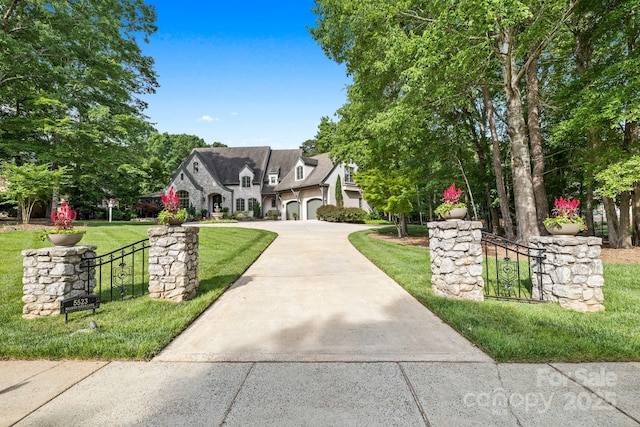 5523 Meadow Haven Ln, Charlotte, NC 28270 - french provincial home with driveway, a front yard, and stone siding