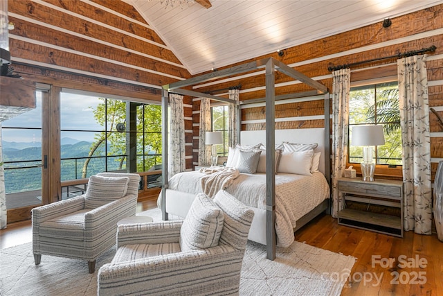 511 Asgi Trl, Maggie Valley, NC 28751 - bedroom with a mountain view, vaulted ceiling, wood-type flooring, access to outside, and multiple windows