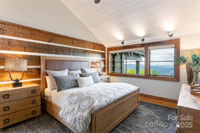 511 Asgi Trl, Maggie Valley, NC 28751 - bedroom featuring vaulted ceiling, baseboards, wood ceiling, and dark wood-type flooring