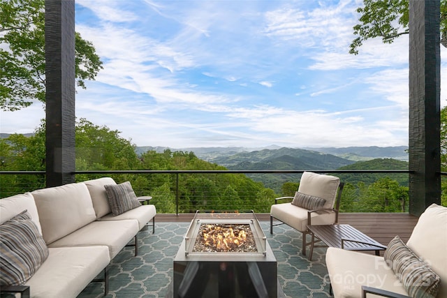 511 Asgi Trl, Maggie Valley, NC 28751 - view of patio featuring an outdoor living space with a fire pit and a mountain view